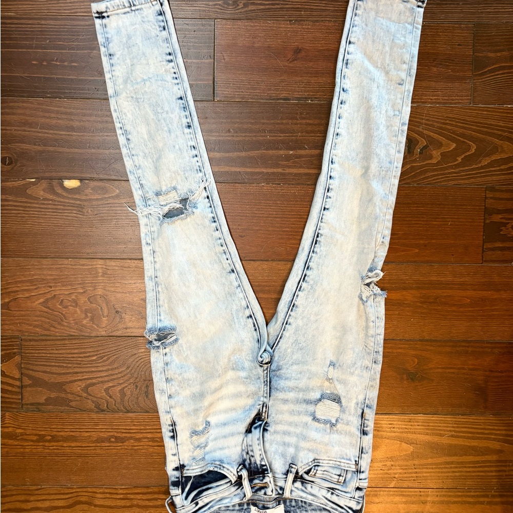 High-Rise Light Blue Skinny Jeans with Distressed Details